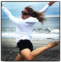 Sheri leaping on the beach
